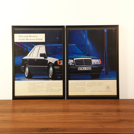 Original vintage Mercedes-Benz W124 advertisement framed in black aluminum. Two-piece wall art set showing a dark blue Mercedes sedan parked at night with the German headline 'Das noch Bessere ist des Besseren Feind'.